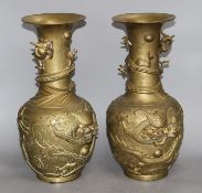 A pair of Chinese gilt bronze vases, decorated with dragons in relief, height 41cm Condition: