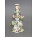 An early Derby figural 'sheep and tree' candlestick, c.1758, 21.5cm Condition: With losses to the