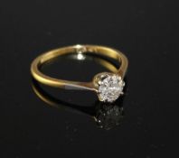 An 18ct and Pt. solitaire diamond ring, size R, gross weight 2.2 grams, stone weight estimated as