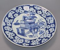 A large Chinese blue and white 'Antiques' dish, 19th century diameter 38cm