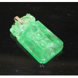 A simulated jade rectangular pendant with yellow metal mount (tests at 9ct gold), carved with