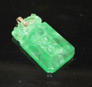 A simulated jade rectangular pendant with yellow metal mount (tests at 9ct gold), carved with