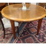 A circular burr walnut marble inset dining table, Diameter 120cm Condition: A few minor surface