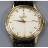 A gentleman's early 1950's 750 yellow metal Omega automatic wrist watch, with honeycomb dial with