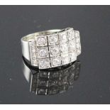 A white metal (stamped 750 and Pt 950) and pave diamond set cocktail ring, of curved design and