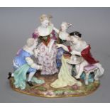 A Meissen group of an elegant lady with attendants, width 23cm, height 19cm Condition: Right hand of