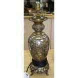 A 19th century French silvered and gilt brass table lamp, decorated with Oriental style flowers,