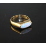 A modern 9ct gold and collet set white opal set dress ring, size M, gross weight 3.9 grams.