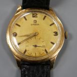 A gentleman's 1950's 18k yellow metal Omega manual wind wrist watch, with Arabic and baton