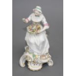 A Chelsea figure of a lady holding a flower basket, c.1765, H. 17.5cm Condition: unmarked,