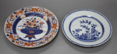 A Chinese Imari plate decorated with flowers in an urn, 25cm and a blue and white plate, 23cm