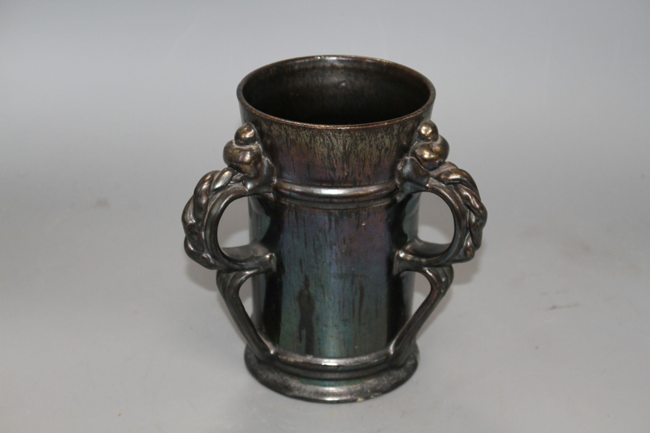 A Dickerware black lustre three handed tyg, early 20th century, indistinct impressed mark, height - Image 2 of 4