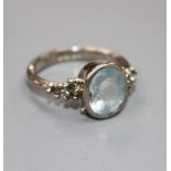 A modern 18ct white gold, aquamarine and marcasite set dress ring, size N, gross weight 5.8 grams.