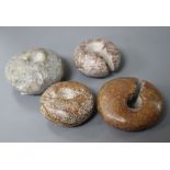 Four Chinese archaistic rings, Huang, possibly neolithic, with natural inclusions to the stone and