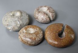 Four Chinese archaistic rings, Huang, possibly neolithic, with natural inclusions to the stone and