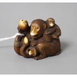 A Japanese stained ivory okimono carved as a group of apes, width 4.5cm, height 3.5cm Condition: