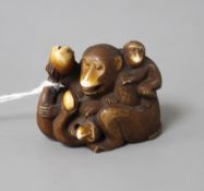 A Japanese stained ivory okimono carved as a group of apes, width 4.5cm, height 3.5cm Condition: