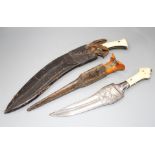 An Indian kukri c.1900, blade 31cms integral with hilt, layered ivory and horn grips, nickel pommel,