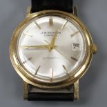 A gentleman's 1960's 9ct gold J.W. Benson automatic wrist watch, on later associated leather