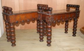 A pair of small late Victorian carved oak hall benches, W.65cm D.25cm H.50cm Condition: One bench