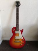 An Encore Les Paul style electric guitar Condition: Rhythm selector switch pickup is intermittent,