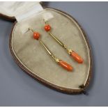 A pair of early-mid 20th century yellow metal (one stamped 15ct) and coral set drop earrings,
