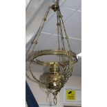 A late Victorian brass hanging oil lamp, drop 84cm Condition: Small knocks and dents from use, a