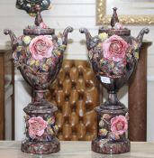 A pair of Italian floral encrusted pottery vases and covers, height 58cm Condition: Some losses to