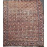 A Mahal red ground carpet, with field of geometric foliate motifs, 386 x 327cm Condition: The carpet
