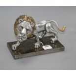 A Frank Meisler parcel gilt pewter model of a lion, no.83/480, on marble stand, length 27cm