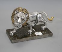 A Frank Meisler parcel gilt pewter model of a lion, no.83/480, on marble stand, length 27cm