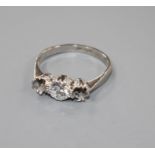 A white metal and single stone (ex three stone) diamond ring, the stone weighing approximately 0.