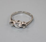 A white metal and single stone (ex three stone) diamond ring, the stone weighing approximately 0.
