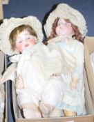 An AM390 doll, good body, 24in., and a Max Handwerk doll, good body, vintage clothes, 22in. (2)