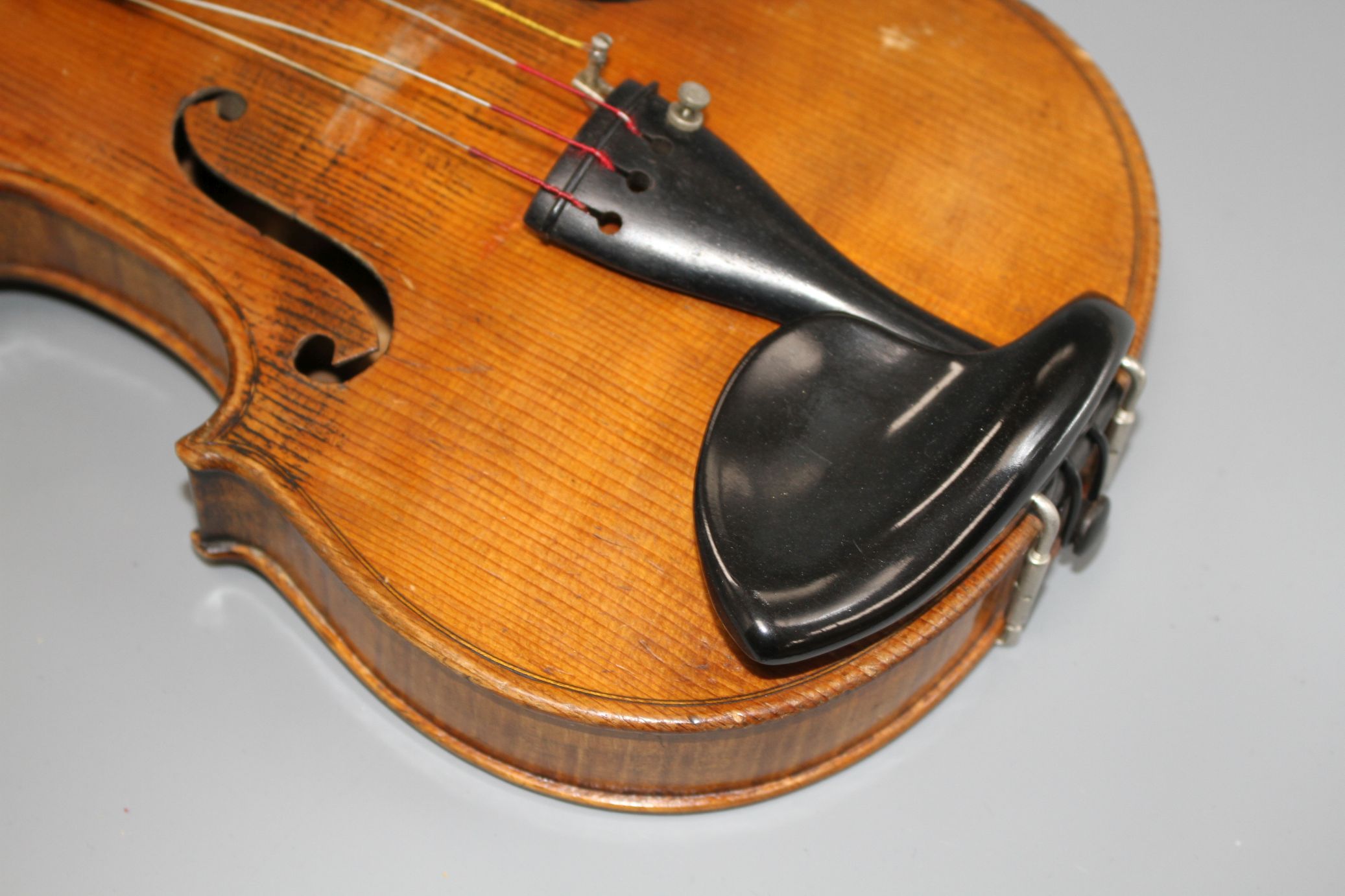 A violin with two piece back and bow, and a child's violin with bow, both with cases Condition:- - Image 7 of 44