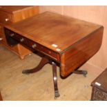 A Regency satinwood banded mahogany sofa table, extended W.144cm D.69cm H.70cm Condition: The top is