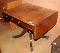 A Regency satinwood banded mahogany sofa table, extended W.144cm D.69cm H.70cm Condition: The top is