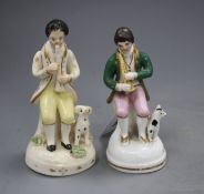Two Staffordshire porcelain figures of musicians seated by a dog, c.1840-50, some wear to the
