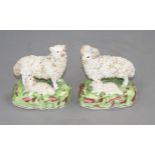 A pair of Staffordshire porcelain groups of sheep and lambs, c.1840-50, typical minor