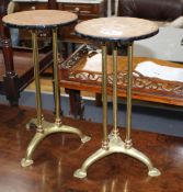 A pair of Edwardian brass stands, now with steel tops, Diam. 20cm H.40cm Condition: Both with