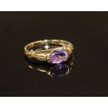 A modern 9ct gold and oval cut amethyst set ring, size P, gross weight 2.3 grams. Condition: Minor
