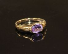 A modern 9ct gold and oval cut amethyst set ring, size P, gross weight 2.3 grams. Condition: Minor