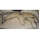 Three assorted brass gas wall light fittings and a larger drop wall light bracket Condition:- one