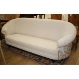 An Italian settee, upholstered in white velvet type material with gold foliate scroll fabric to