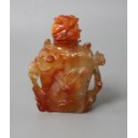 A Chinese orange agate snuff bottle and stopper, carved in relief with birds and flowers, width 6cm,
