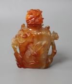 A Chinese orange agate snuff bottle and stopper, carved in relief with birds and flowers, width 6cm,