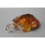 A modern Lalique amber tinted glass model of a turtle, signed with Made in France sticker, length