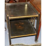 A 1920s black lacquered two tier trolley, with gilt floral decoration, W.63cm D.55cm H.71cm