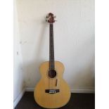 A Woodstock electro acoustic bass guitar Condition: Electrics are working, crackle to selectors, a
