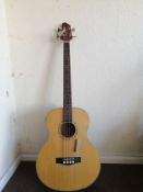 A Woodstock electro acoustic bass guitar Condition: Electrics are working, crackle to selectors, a